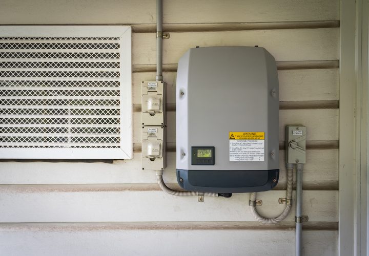 Solar inverter installed on an external wall.