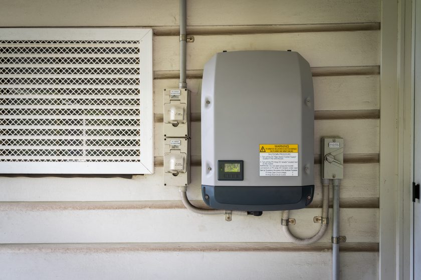 Solar inverter installed on an external wall.
